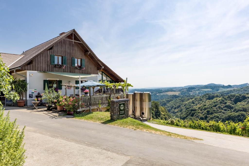 a house on a hill with a view at Weingut Peter Skoff - Domäne Kranachberg in Gamlitz