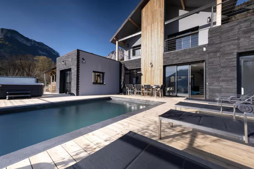 a swimming pool in the backyard of a house at Villa Bamboo in Lathuile