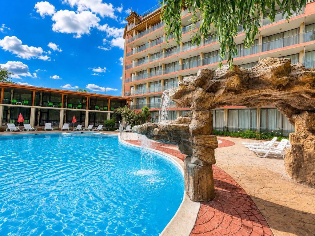 a swimming pool in front of a hotel at Hotel Jupiter in Sunny Beach