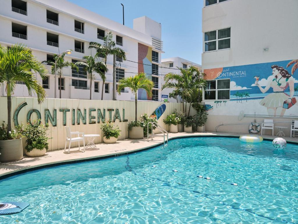 a swimming pool in front of a hotel at Hotel Continental Miami Beach, Tapestry Collection by Hilton in Miami Beach