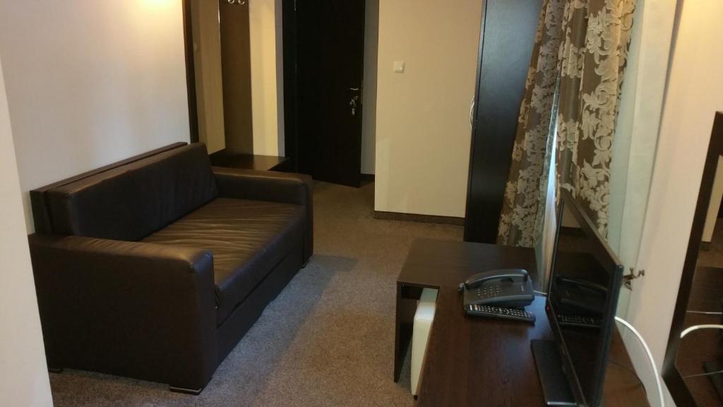 TV a/nebo společenská místnost v ubytování Hunting Residence Lodge