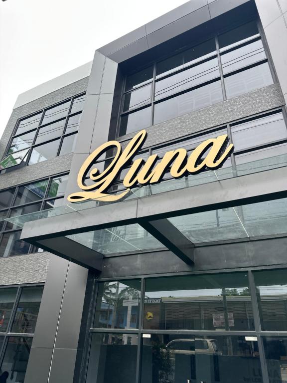 a julda sign on the side of a building at LUNA by LCB Apartelle and Resort Tagaytay in Tagaytay
