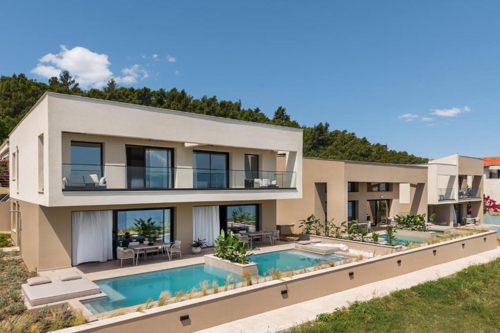 an image of a villa with a swimming pool at Aeolia Residences in Nea Potidaea