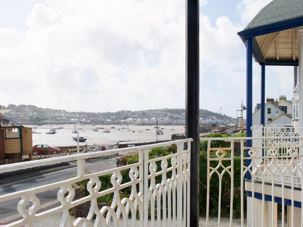 a balcony with a view of the water at The Captains House in Instow