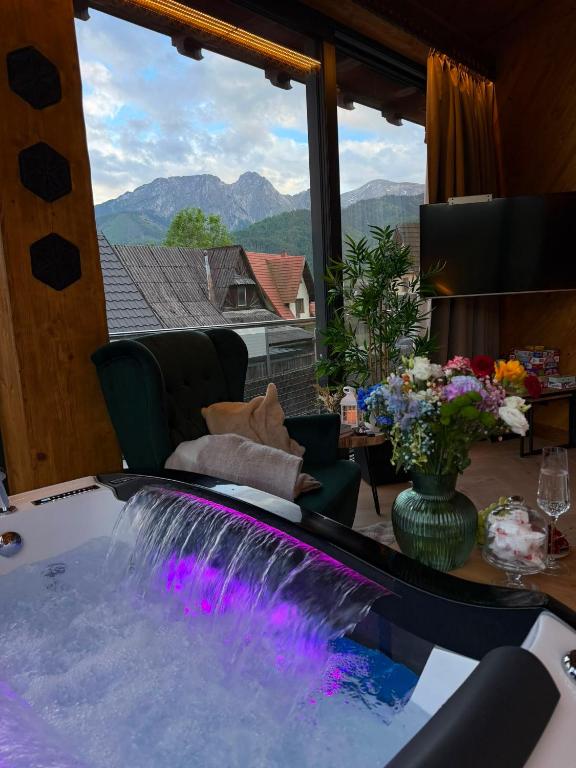a hot tub in a room with a view at View Apartament Kasprowy Wierch Premium DeLuxe & SPA in Kościelisko
