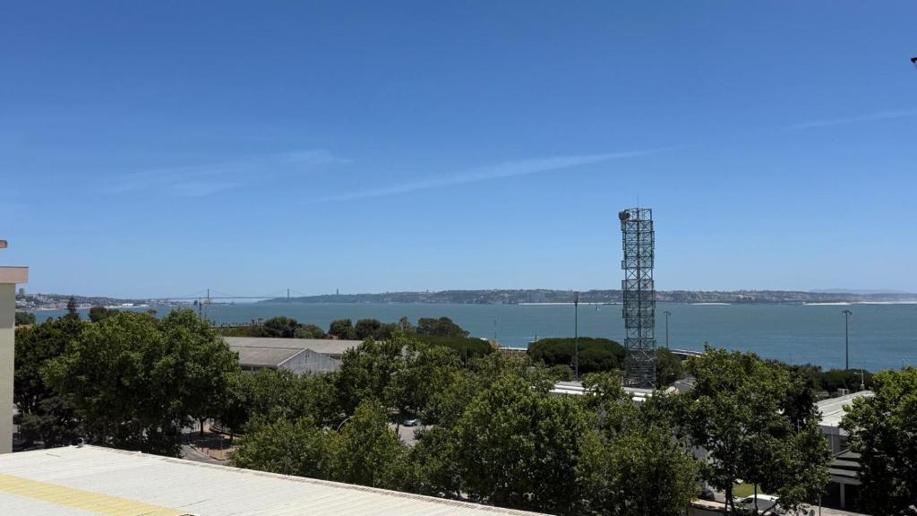 a view of the water from the roof of a building at Casa Nautica in Paço de Arcos