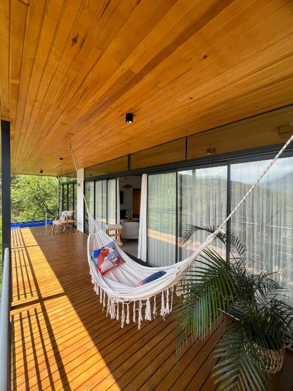 a hammock hanging from the ceiling of a house at Alaçam Tatil Evleri in Trabzon