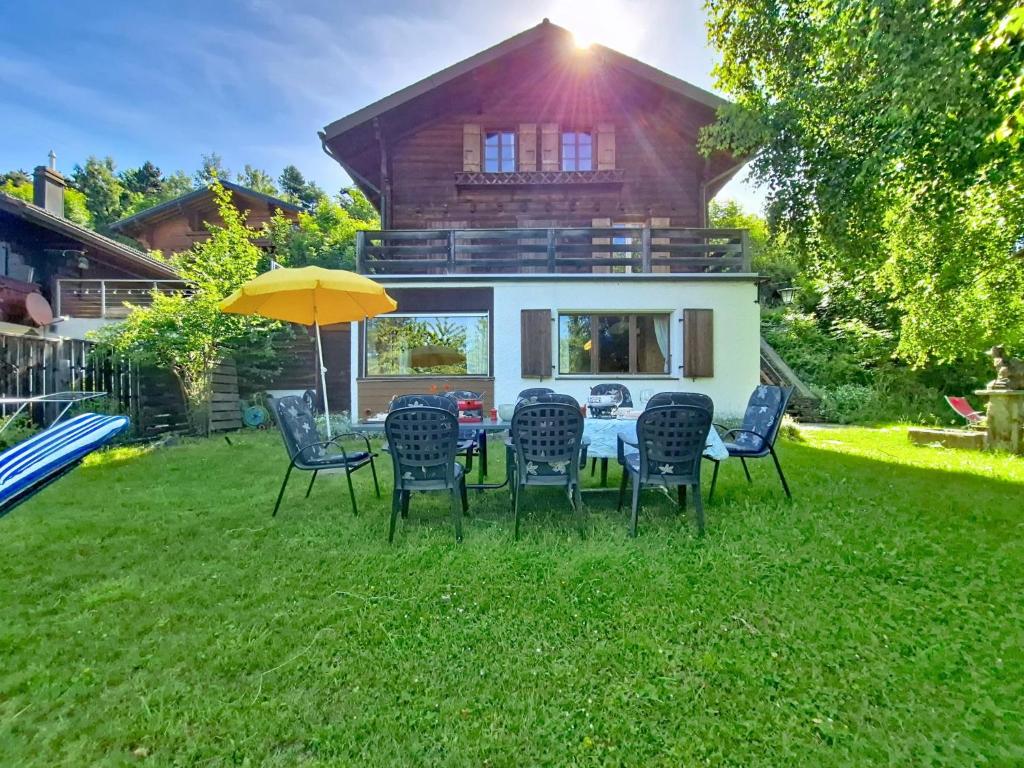 a table and chairs in the yard of a house at Chalet Chalet Le Rhônasson by Interhome in Vercorin