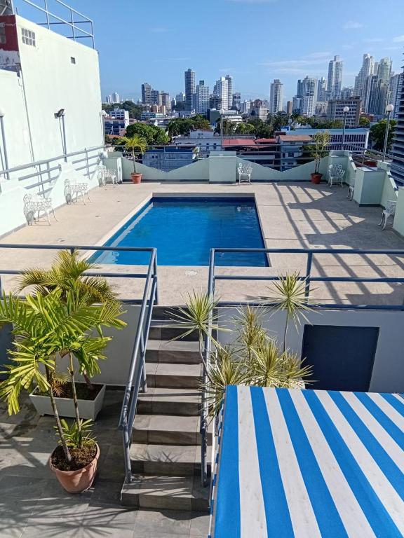 a swimming pool on the roof of a building at HOTEL 2 Mares PANAMA in Panama City