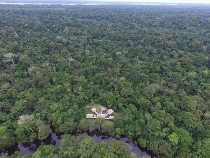 an aerial view of an airplane in the middle of a forest at Amazon Bromelia Lodge & Expeditions in Iquitos