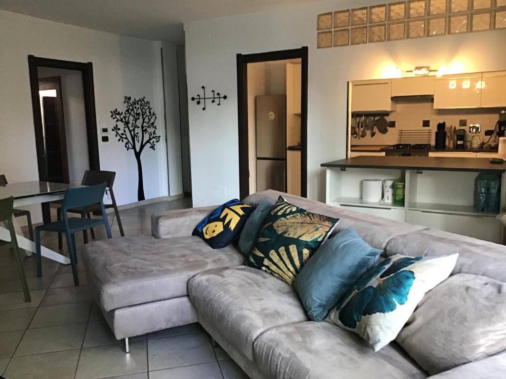 a living room with a couch and a kitchen at My house in Turin