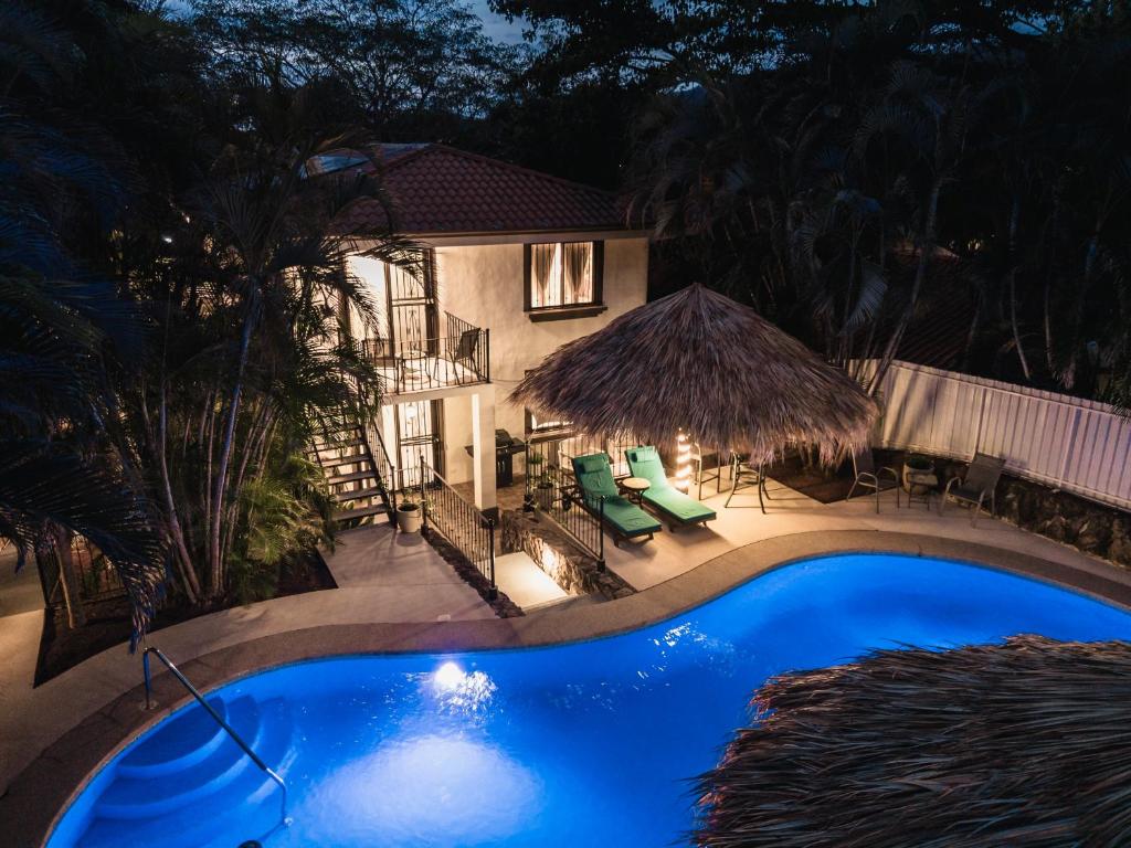 an overhead view of a swimming pool at night at Coco Garden Suites in Coco