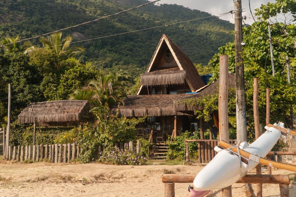 a small hut with a white object in front of it at MAMBEMBE hostel - Ilha Grande, Vila do Abraão in Abraão