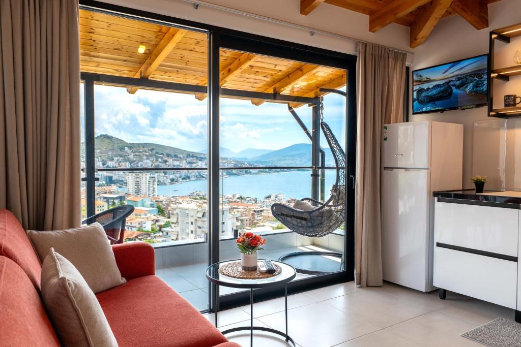 a living room with a view of the city at Crown Villa in Sarandë