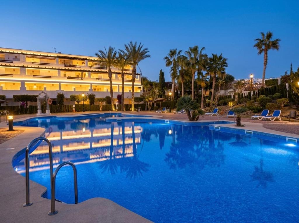a large swimming pool in front of a building at Heavenly Homes Mojacar 75 in Mojácar