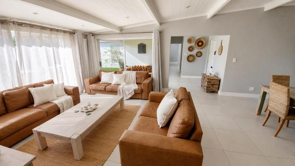 a living room with a couch and a coffee table at Pet-Friendly, 3-Bed, 2-Bath in Knysna Central in Knysna