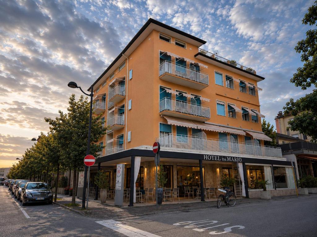a building on the corner of a street at Hotel Da Mario in Caorle
