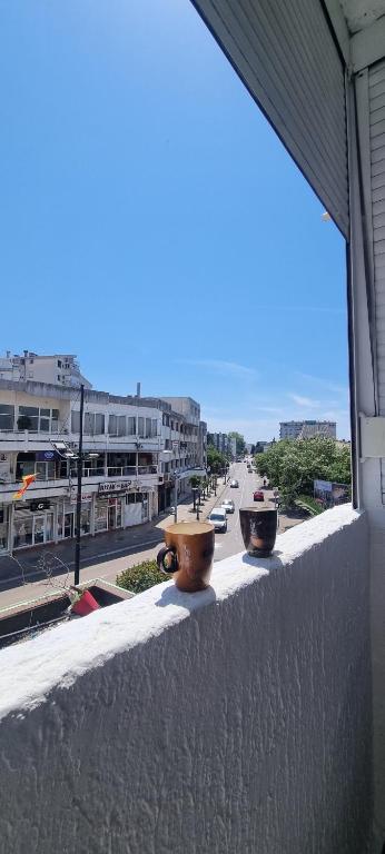a view of a city street from a balcony at Tri Kule Apartman in Bar