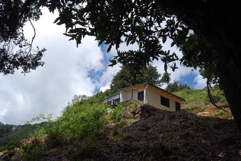 a small house on top of a hill at Calcopirita Stay House in Rivas
