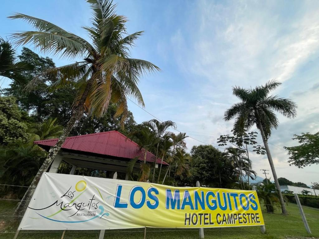 a sign for a los maritos hotel committee at Restaurante - Hotel Los Manguitos in Rivera