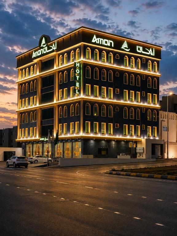 a large building with a sign on the side of it at فندق امان أبها - المعالي in Abha