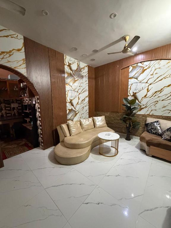 a living room with a couch and a table at Home stays in Jammu