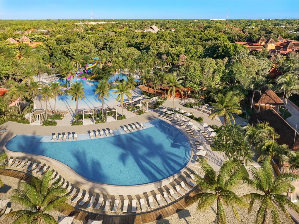 an overhead view of a pool at a resort at Iberostar Waves Quetzal - All Inclusive in Playa del Carmen