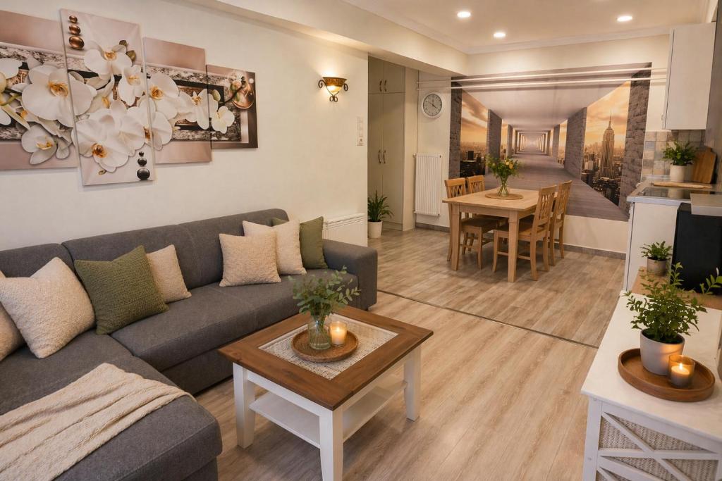 a living room with a couch and a table at Evergreen Residence VárLak in Debrecen