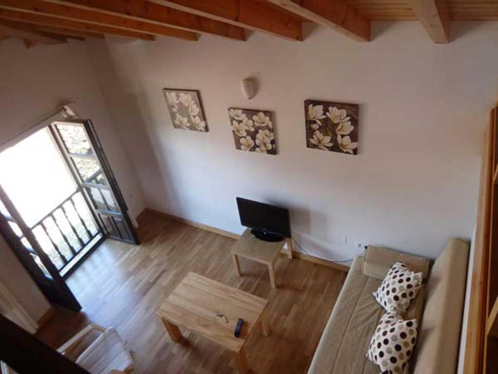 Televízia a/alebo spoločenská miestnosť v ubytovaní Apartamentos Casa de la Abuela