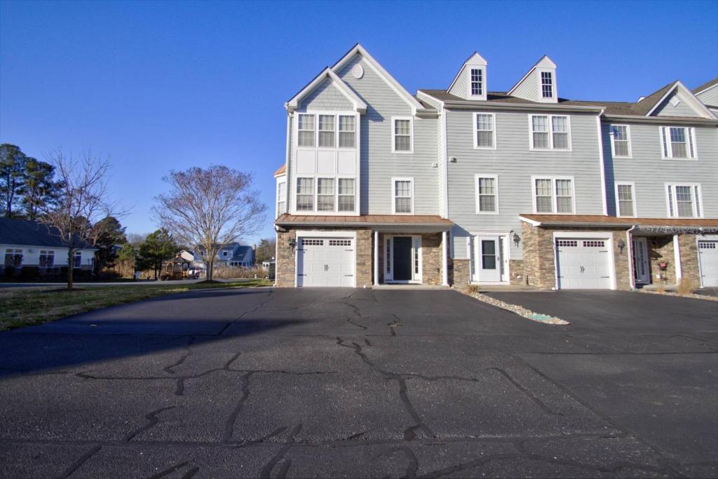 a large house with a driveway in front of it at 11 Mooring La in Millville