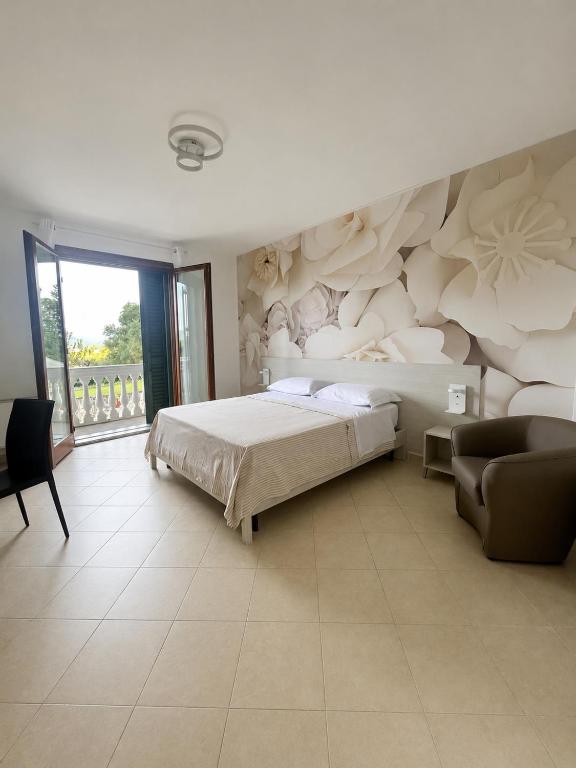 a bedroom with a bed and a wall with a mural at B&B Clav's Home - bebclavshome in Pozzilli