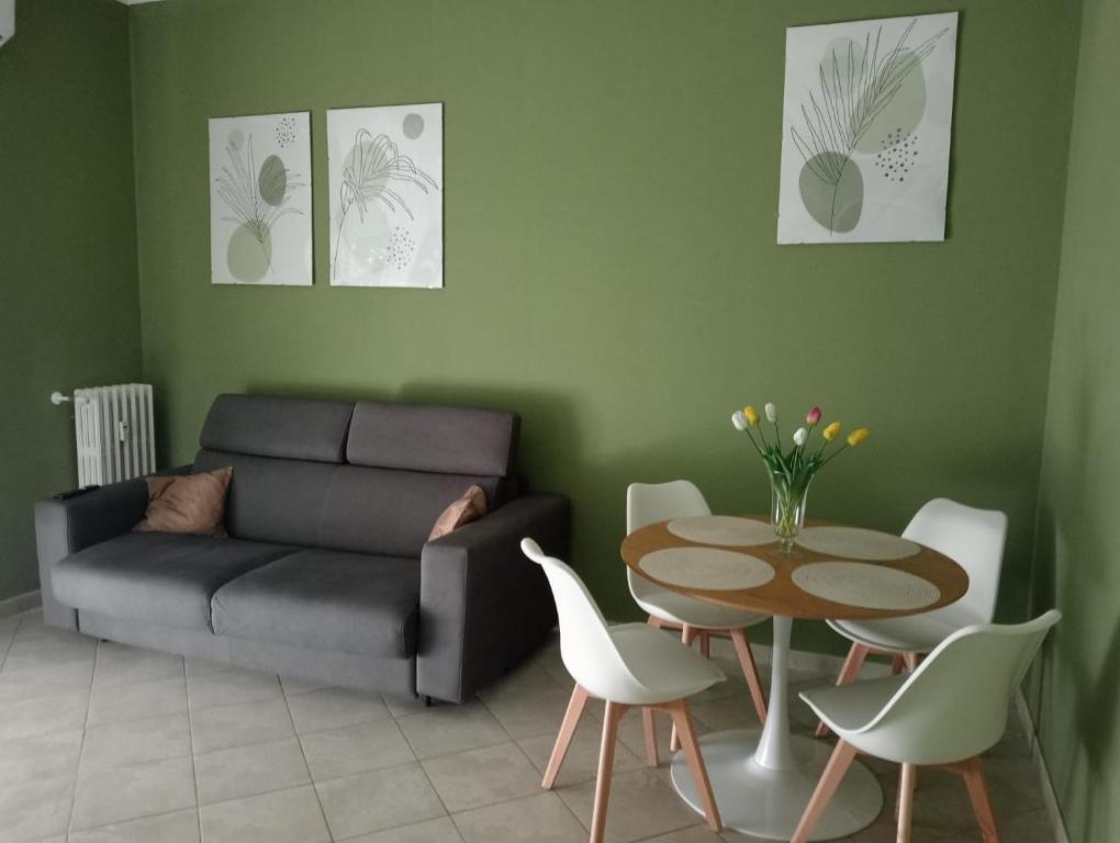 a living room with a couch and a table at Casa Rosa in Vigevano
