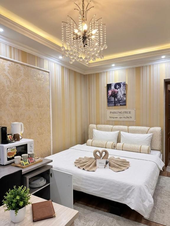 a bedroom with a large bed with a bow on it at Stefan 64 in Chişinău
