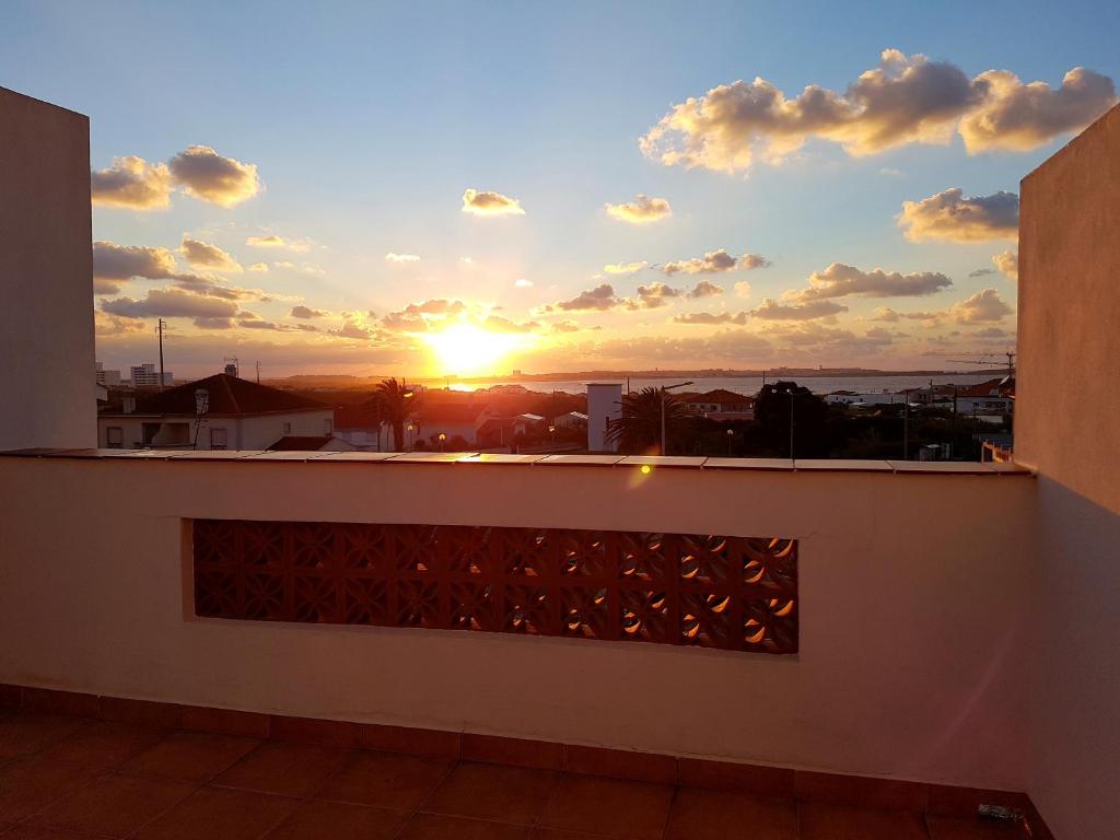 a sunset from the balcony of a house at T2 Baleal in Peniche