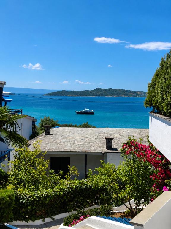a view of the ocean from a building at Brilliance Sea View Apartments in Ouranoupoli