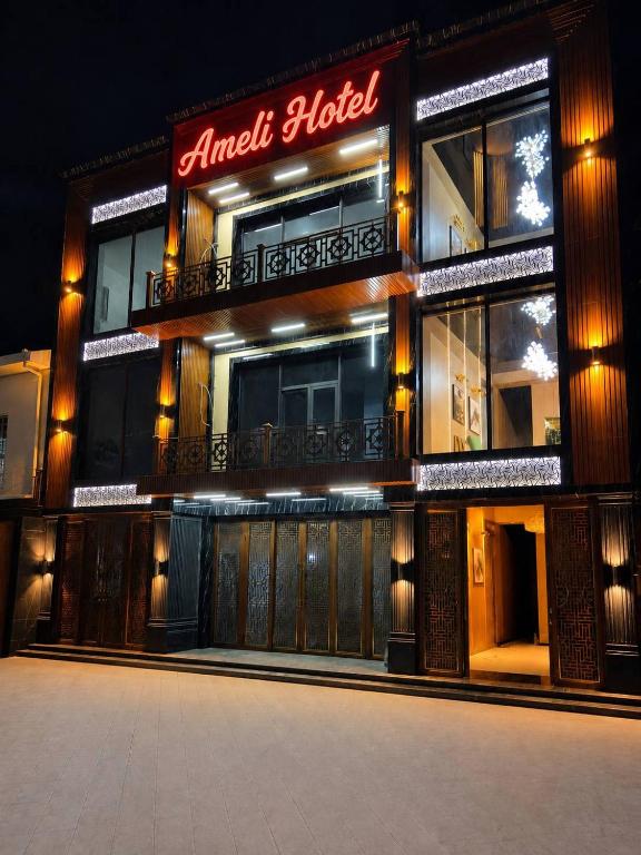 a building with a sign that reads angel hotel at Ameli Plaza Hotel Tashkent in Yakkasaray