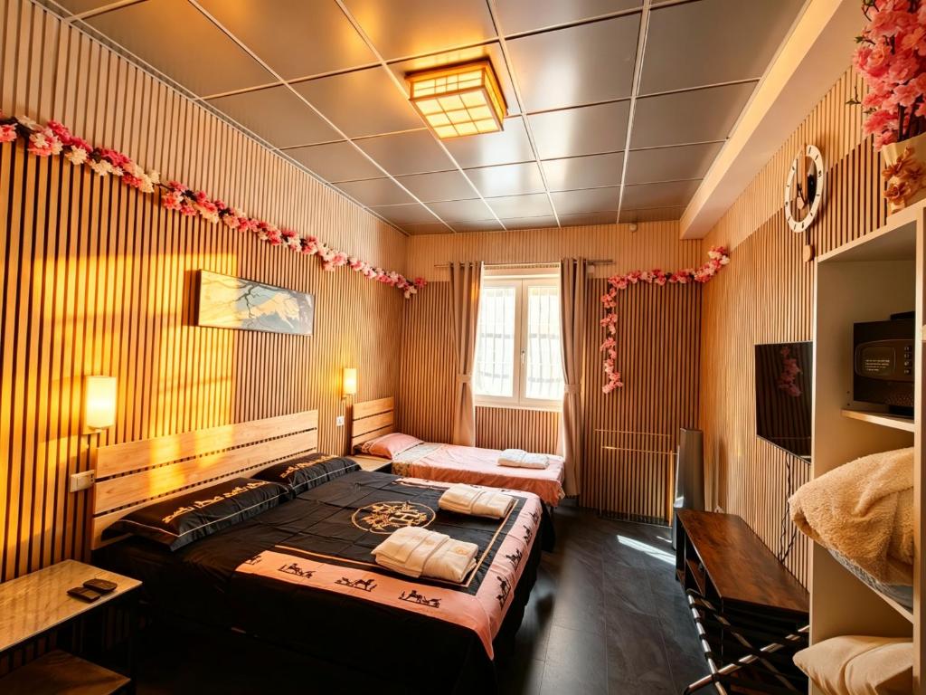 a bedroom with a large bed in a room at BED & BREAKFAST SAKURA in Milan