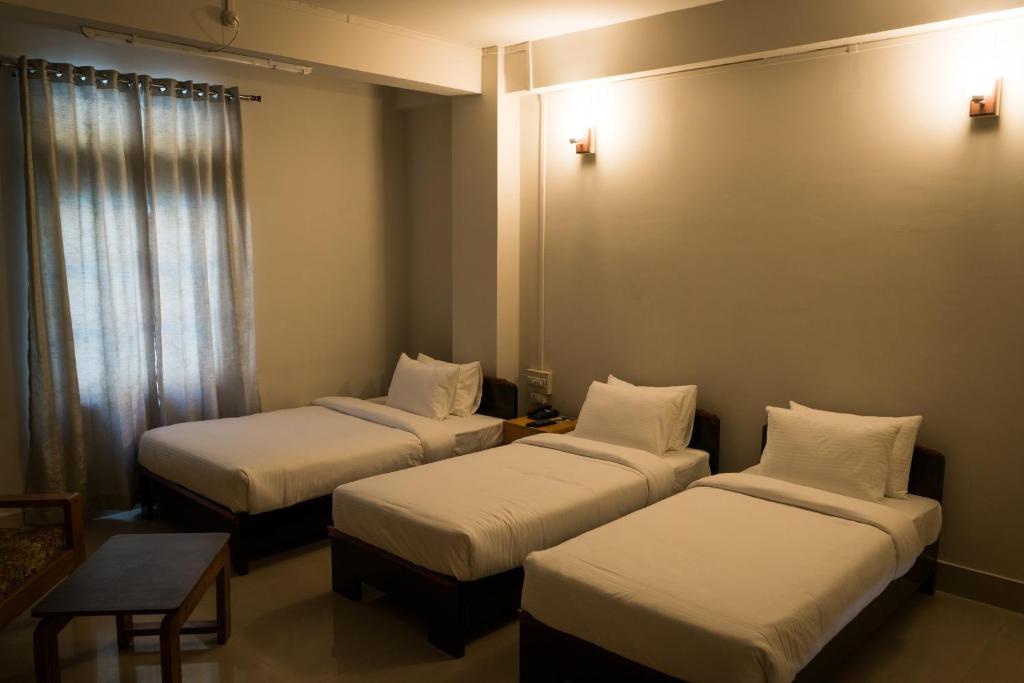 Postel nebo postele na pokoji v ubytování Hotel Ariel