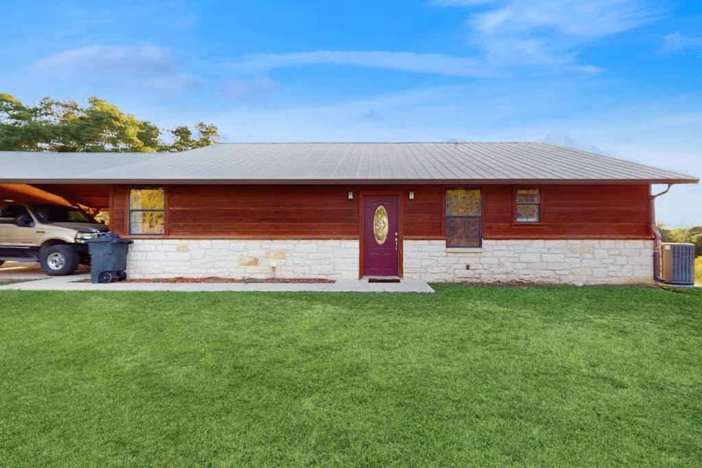 a house with a car parked in front of it at Ranch Home with Hot Tub on 7 Secluded Acres - Minutes to Downtown Fredericksburg in Fredericksburg