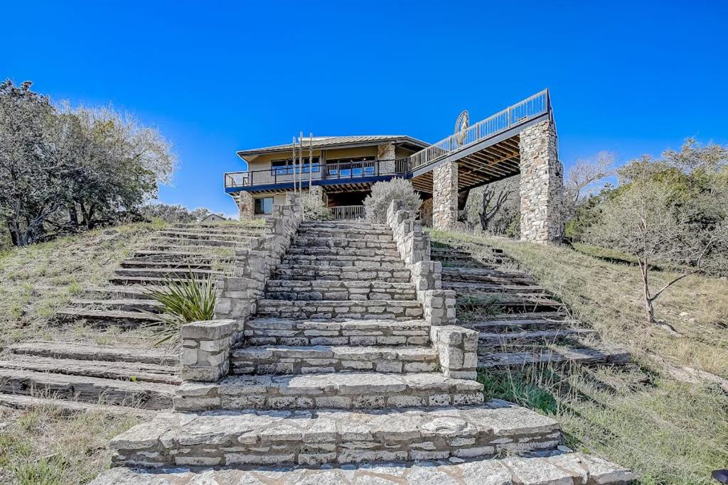 a set of stairs leading up to a building at Stunning Lakefront Home with 2 Patios, Chef's Kitchen, & Lake Access in Spicewood