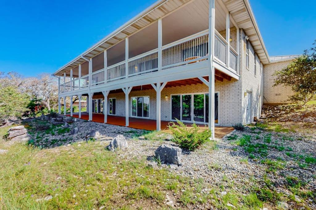 a large house with a balcony on the side of it at 2-Story Home with Covered Patio, Balcony, Fireplace, Streaming, Great Views, W/D in Kerrville