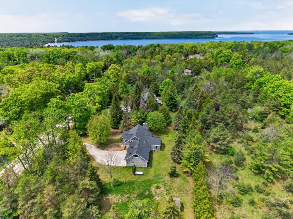 an aerial view of a house in the woods at Cottage on the Hill in Ephraim