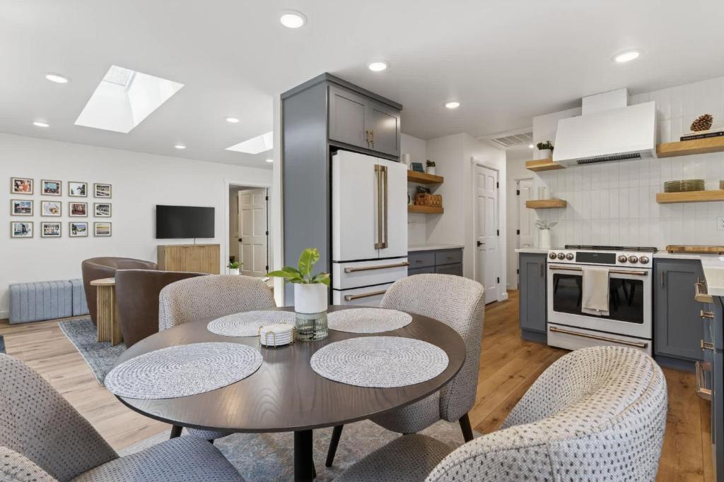 a kitchen and dining room with a table and chairs at Maevebrook in Sister Bay