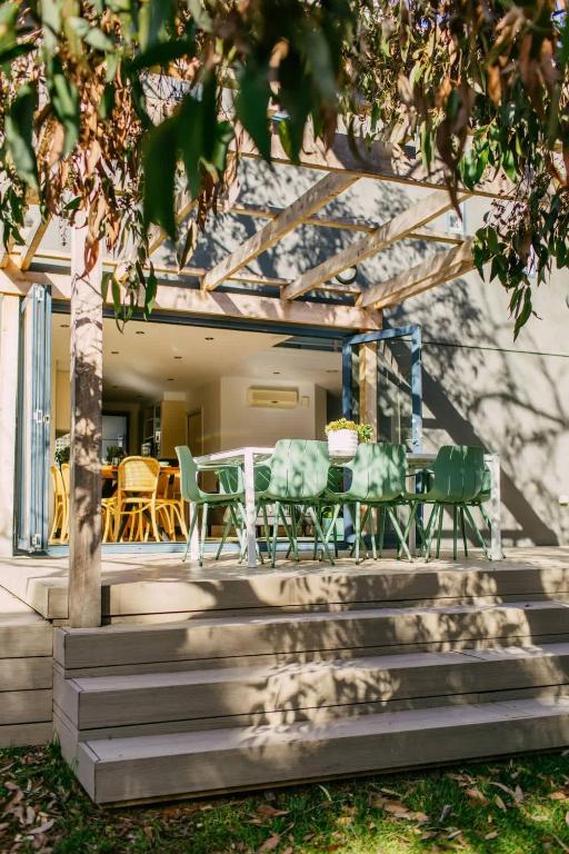 a patio with a table and chairs under a pergola at Perfect Beachside Escape - Walk Everywhere in Anglesea