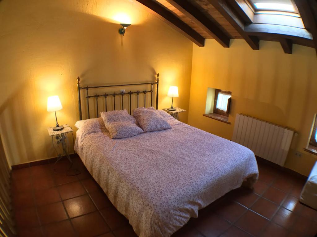 Cama o camas de una habitación en El Bulin de Horcajuelo