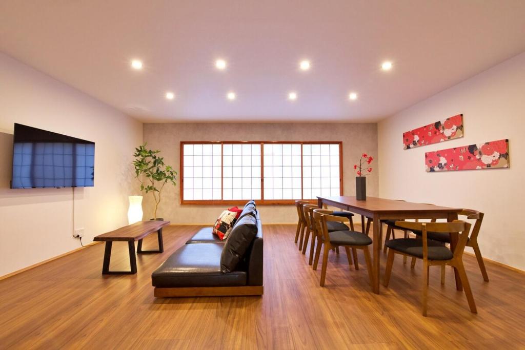 a living room with a couch and a table at OKU - Nakasendo - in Shiojiri
