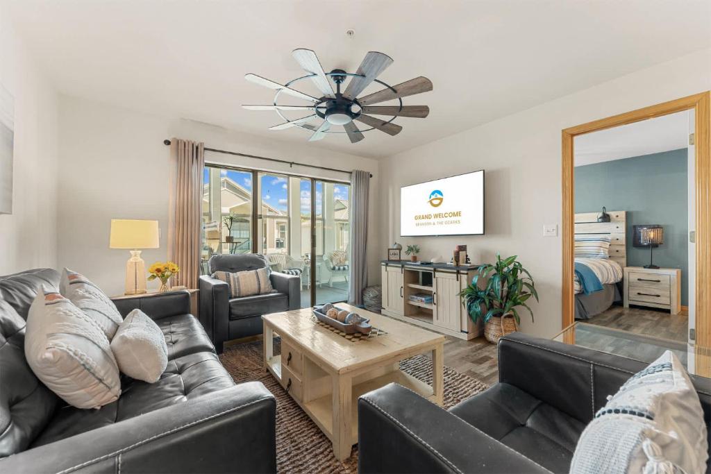 a living room with couches and a table at Emerald Bay Escape with Sunroom in Hollister