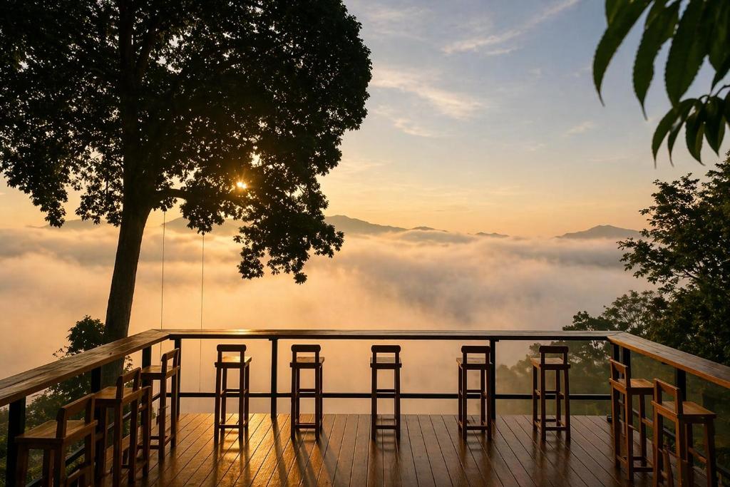 a deck with bar stools and a view of the mountains at 4sky in Ban Kai Noi