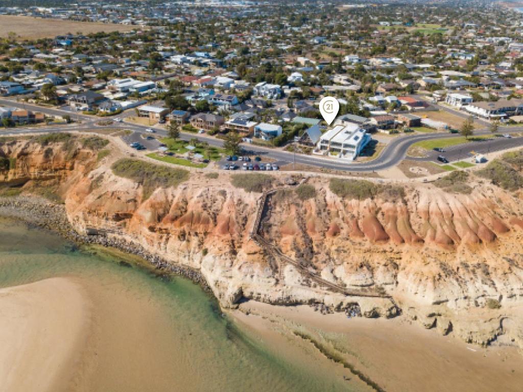 an aerial view of a beach next to a cliff at Meander - Port Noarlunga South - C21 SouthCoast Holidays in Port Noarlunga South