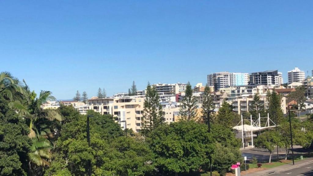 a city skyline with tall buildings and trees at Beachside Court Unit 9 in Caloundra